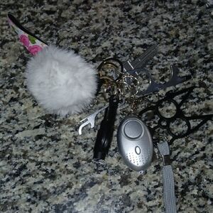 White Faux Fur Pom Pom Keychain with Silver Alarm